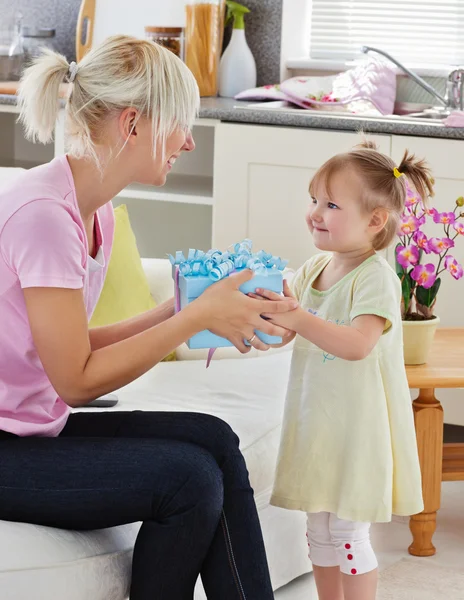 Good-looking woman get surprise by her daughter — Stock Photo, Image