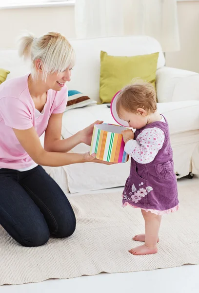 Young mother get surprise by her daughter — Stock Photo, Image