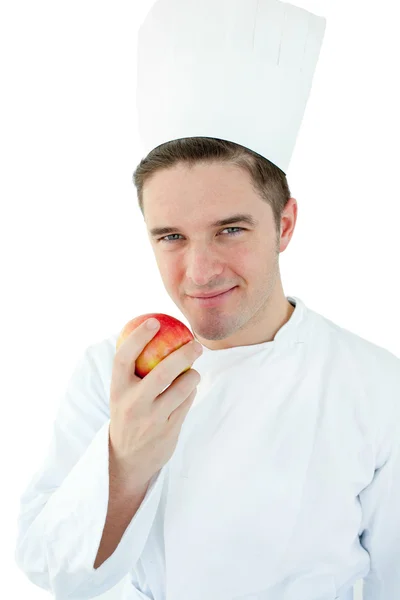 Koch hält einen Apfel in der Hand — Stockfoto