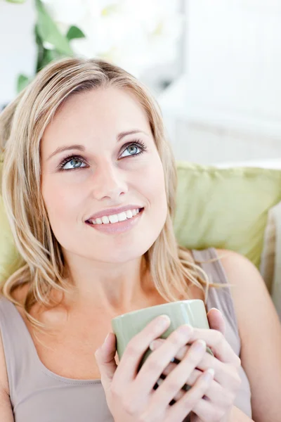 Charming woman holding cup of coffee — Stock Photo, Image