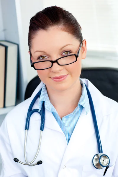 Confident female doctor smiling at the camera — Stock Photo, Image
