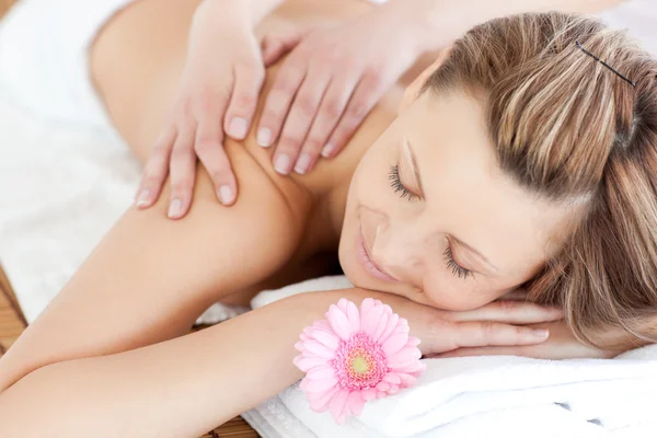 Delighted young woman receiving a back massage — Stock Photo, Image