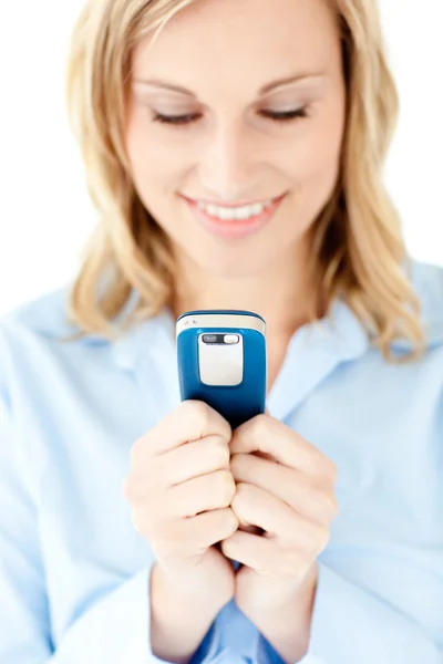 Radiant young woman writing a message on her cellphone — Stock Photo, Image