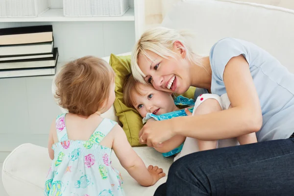 Woman is hugging her daughter — Stock Photo, Image