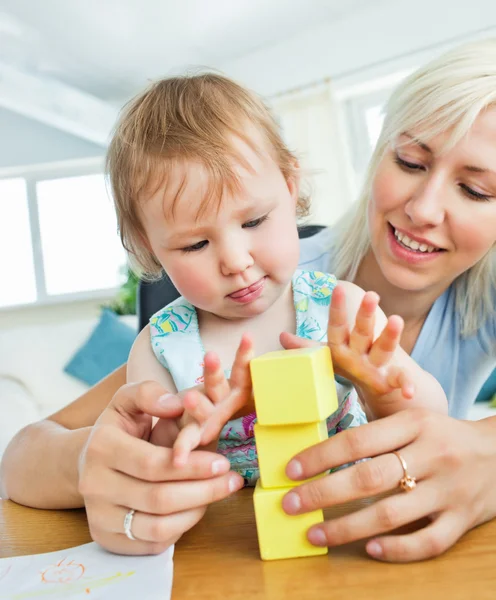 Blond mother and her daughter playing — Stock Photo, Image