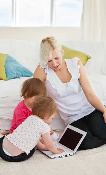 Small family having fun with a laptop — Stock Photo, Image