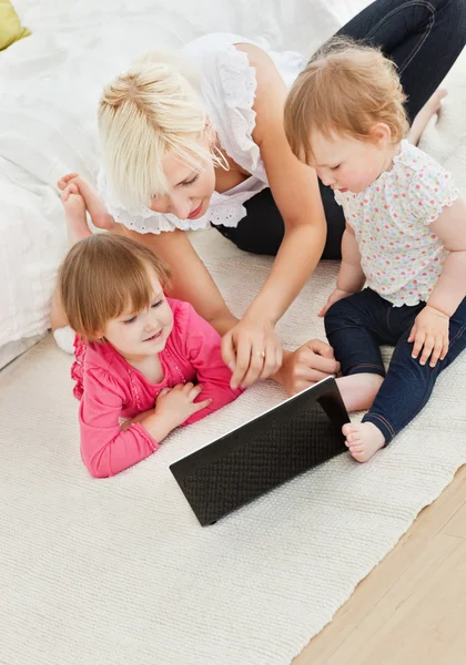 Cute family having fun with a laptop — Stock Photo, Image