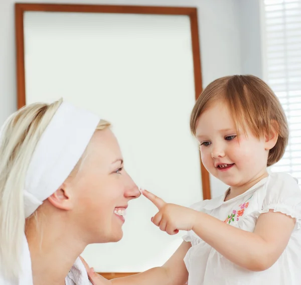 Beautiful mother taking care of her child — Stock Photo, Image