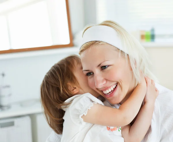 Shining mother taking care of her child — Stock Photo, Image