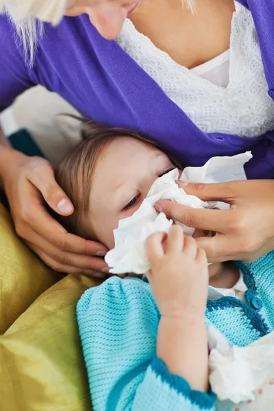 Mother taking care of her ill child — Stock Photo, Image