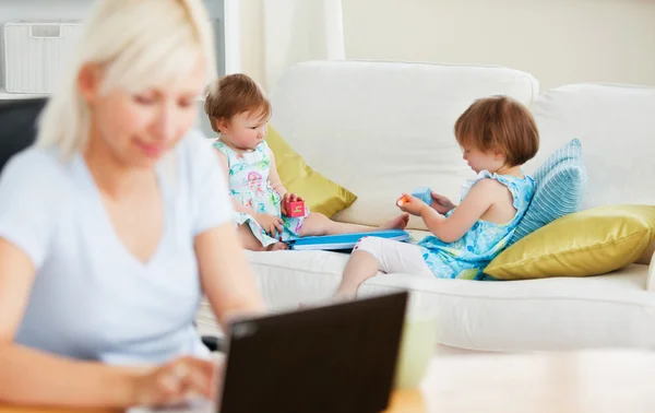 Relaxed family having fun with a laptop — Stock Photo, Image