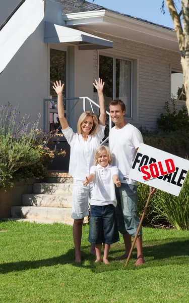 Young family and their new house Stock Picture