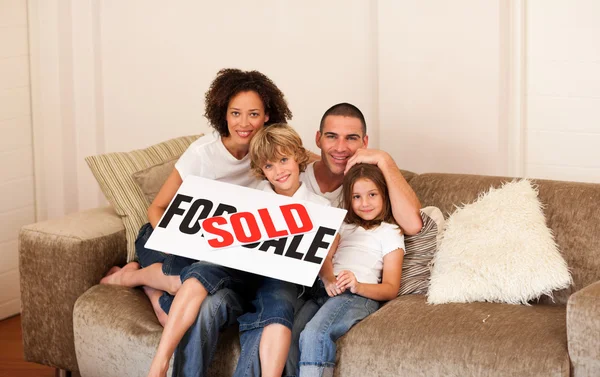 Smiling family in their new house Stock Image