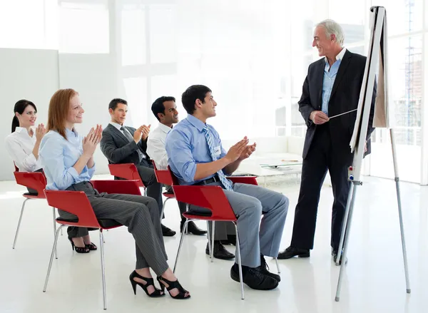 Business applauding at the end of a conference — Stock Photo, Image