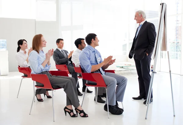 Senior businessman giving a conference — Stock Photo, Image