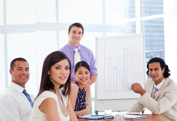Young businessman presenting figures — Stock Photo, Image