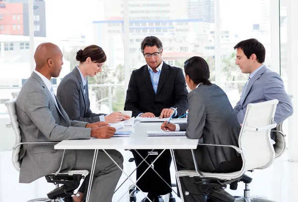 A diverse business group disscussing a budget plan — Stock Photo, Image