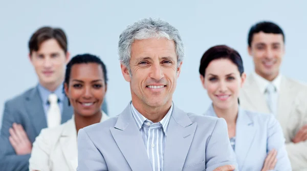 Smiling business team showing ethnic diversity Stock Image