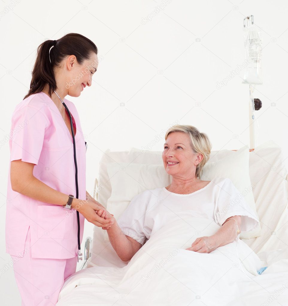 Beautiful Smiling Nurse Helping A Senior Patient Stock Photo By