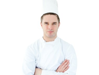 Attractive young chef with folded arms clipart