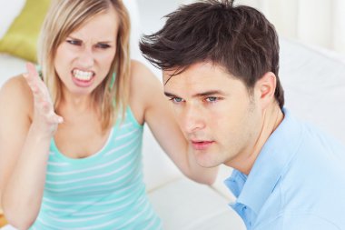 Young man ignoring his girlfriend getting worked up clipart