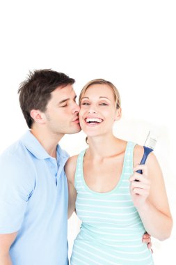 Loving couple painting a room clipart