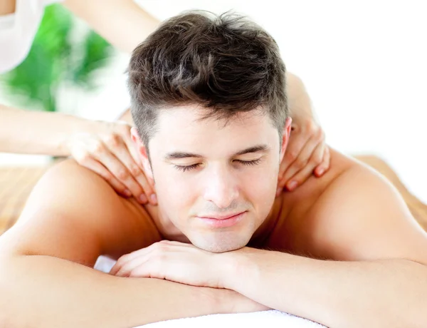 Handsome caucasian man having a back massage — Stock Photo, Image