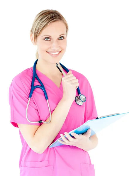 Thoughtful female surgeon holding a clipboard — Stock Photo, Image