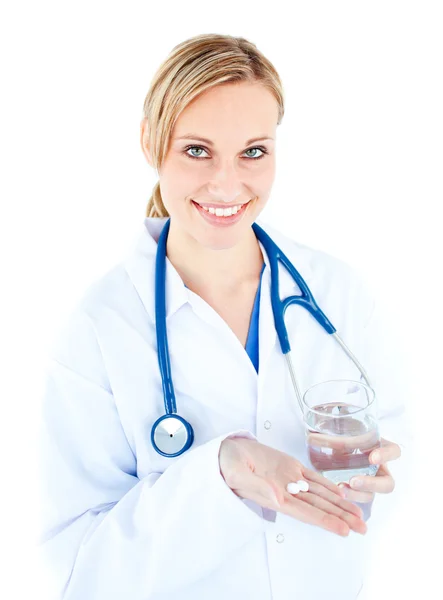 Pretty female doctor holding pills and water — Stock Photo, Image