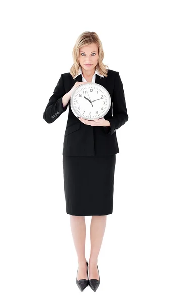 Nödställda affärskvinna innehar en klocka — Stockfoto