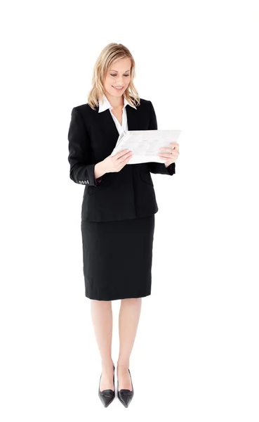 Self-assured businesswoman reading a newspaper — Stock Photo, Image