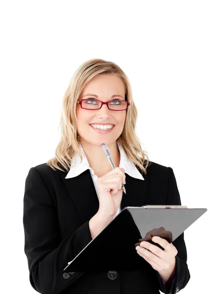 Thoughtful businesswoman holding a clipboard — Stock Photo, Image