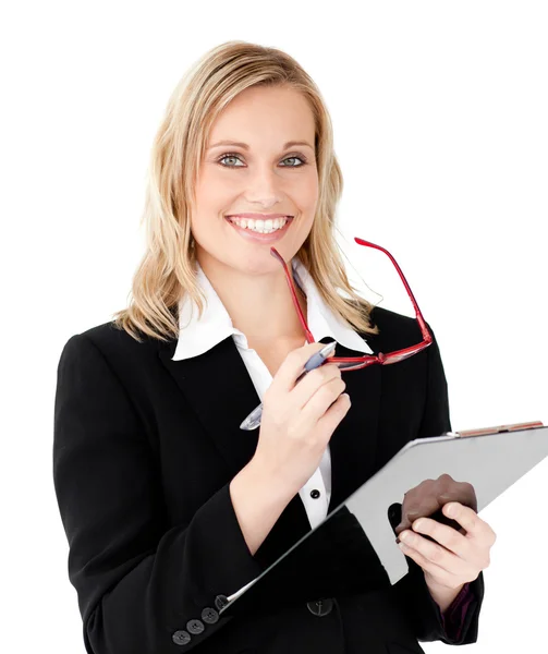 Charismatic businesswoman holding a clipboard — Stock Photo, Image