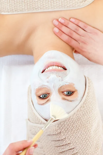 Captivating woman having white cream on her face — Stock Photo, Image