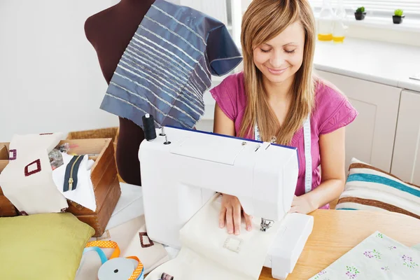 Bright woman sewing at home — Stock Photo, Image