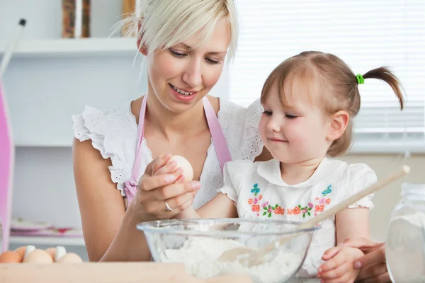 Happy mother and daughter baking together — Stock Photo, Image