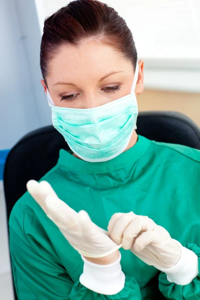 Serious female surgeon wearing scrubs — Stock Photo, Image