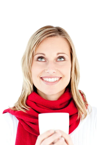 Blissful young woman holding a cup wearing a scarf — Stock Photo, Image