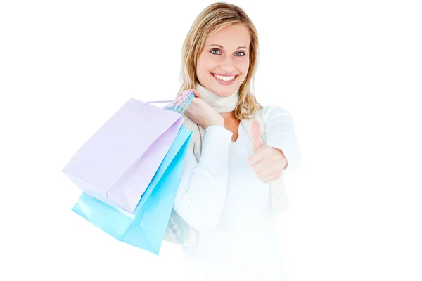 Positive woman with shopping bags and thumb up — Stock Photo, Image