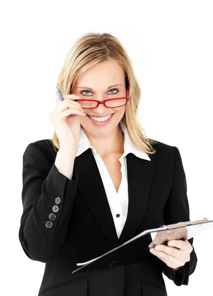 Positive businesswoman holding a clipboard — Stock Photo, Image