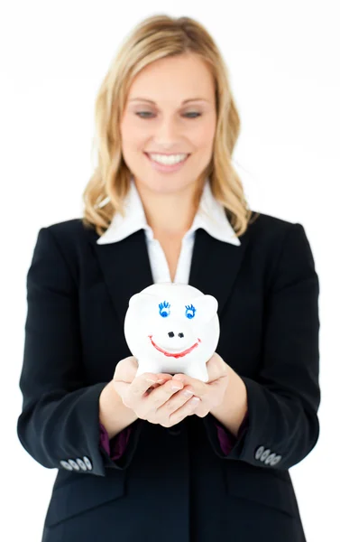 Charming businesswoman holding a piggy-bank — Stock Photo, Image