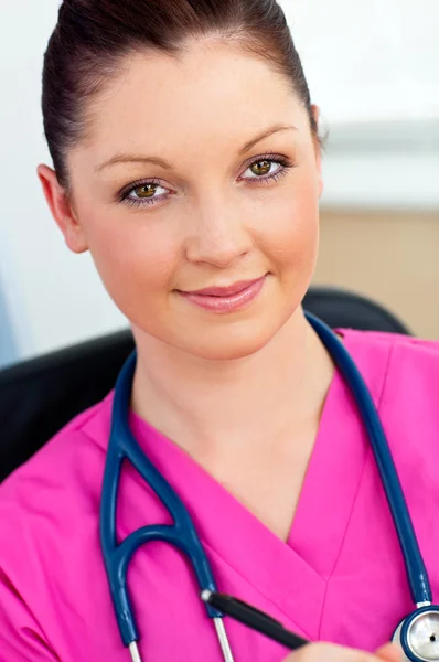 Sophisticated female surgeon smiling at the camera — Stock Photo, Image