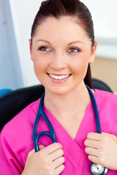 Pretty female surgeon smiling at the camera — Stock Photo, Image