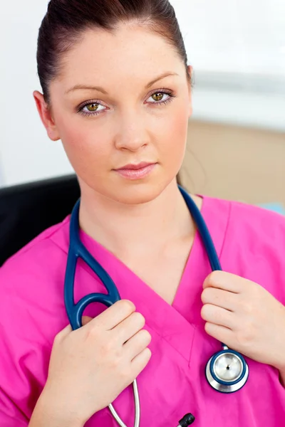 Sophisticated female surgeon looking at the camera — Stock Photo, Image