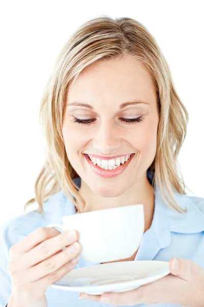 Glowing businesswoman holding a cup of coffee — Stock Photo, Image