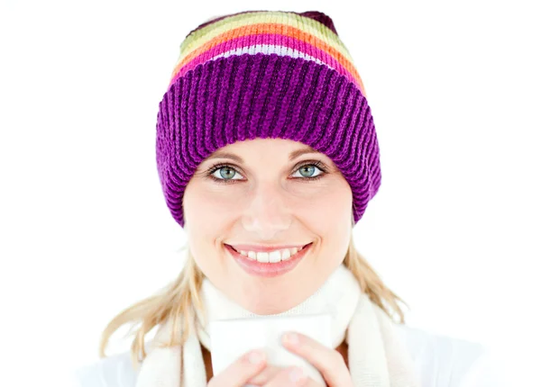 Glowing woman wearing a white pullover and a colorful hat — Stock Photo, Image