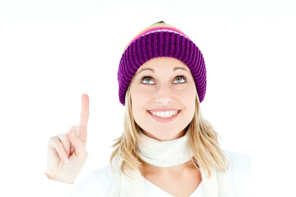 Bright woman with a colorful hat pointing upwards — Stock Photo, Image