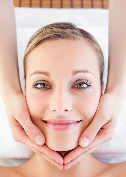Portrait of a cheerful young woman receiving a head massage — Stock Photo, Image