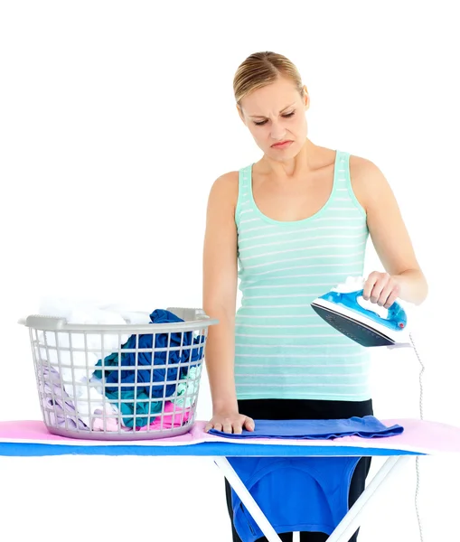 Unhappy woman ironing — Stock Photo, Image