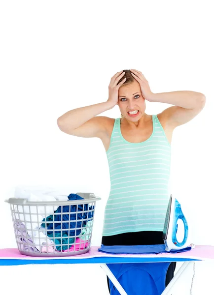 Upset woman ironing — Stock Photo, Image